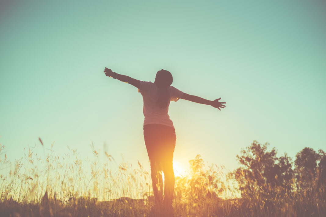 lifestyle concept - beautiful happy woman enjoying fresh air.