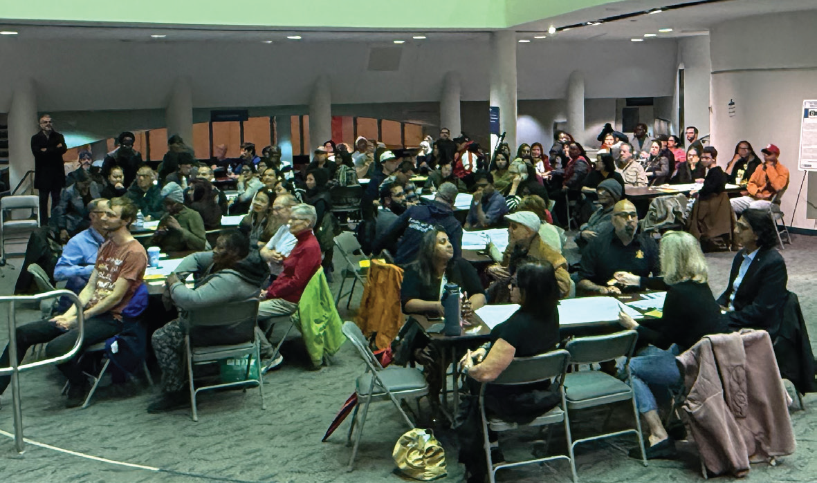 use photo of the people at tables: Residents attend a budget consultation at Scarborough Civic Centre. (Courtesy Neethan Shan social media.)