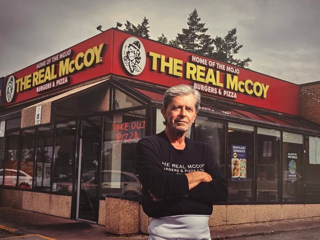 George Mihail in front of The Real McCoy original location on Markham Road.