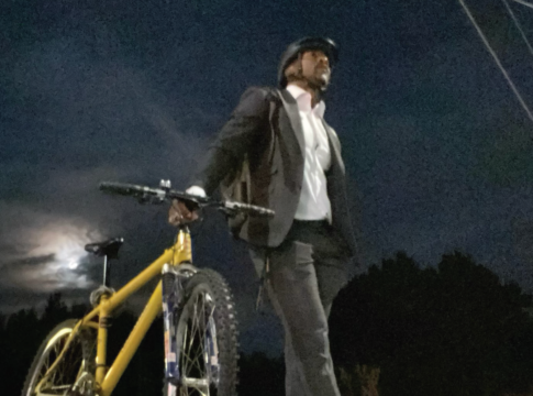 picture of Councillor Martin Reid holding e-bike and saying there is no bike war in Mississauga